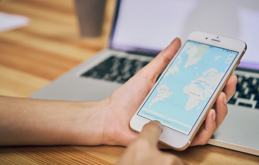How to Get to The TOP of Google Maps 3 women hold phone with show screen google maps