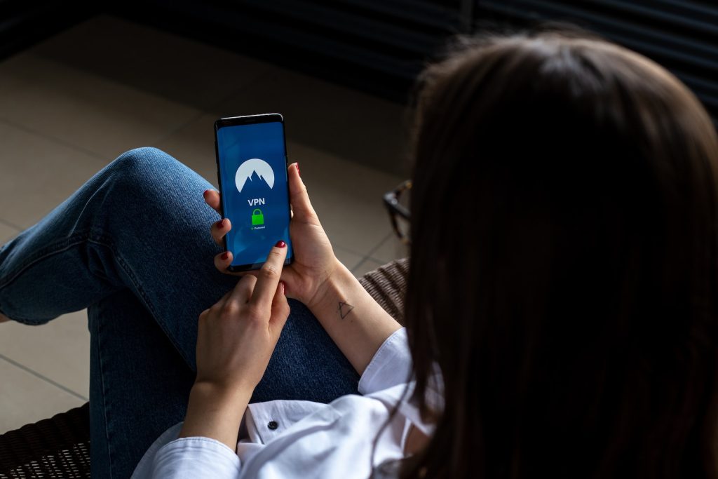 Viggle App Review woman using smartphone