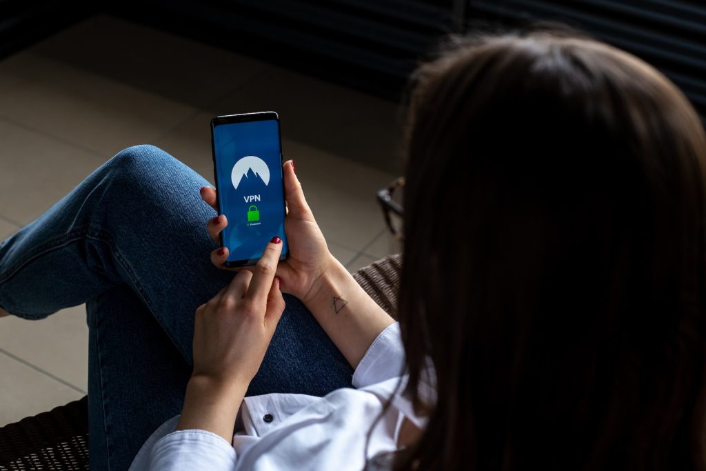 The Ultimate Viggle App Review: Earn Money Watching TV or a Time-Wasting Scam? 4 Viggle App Review woman using smartphone