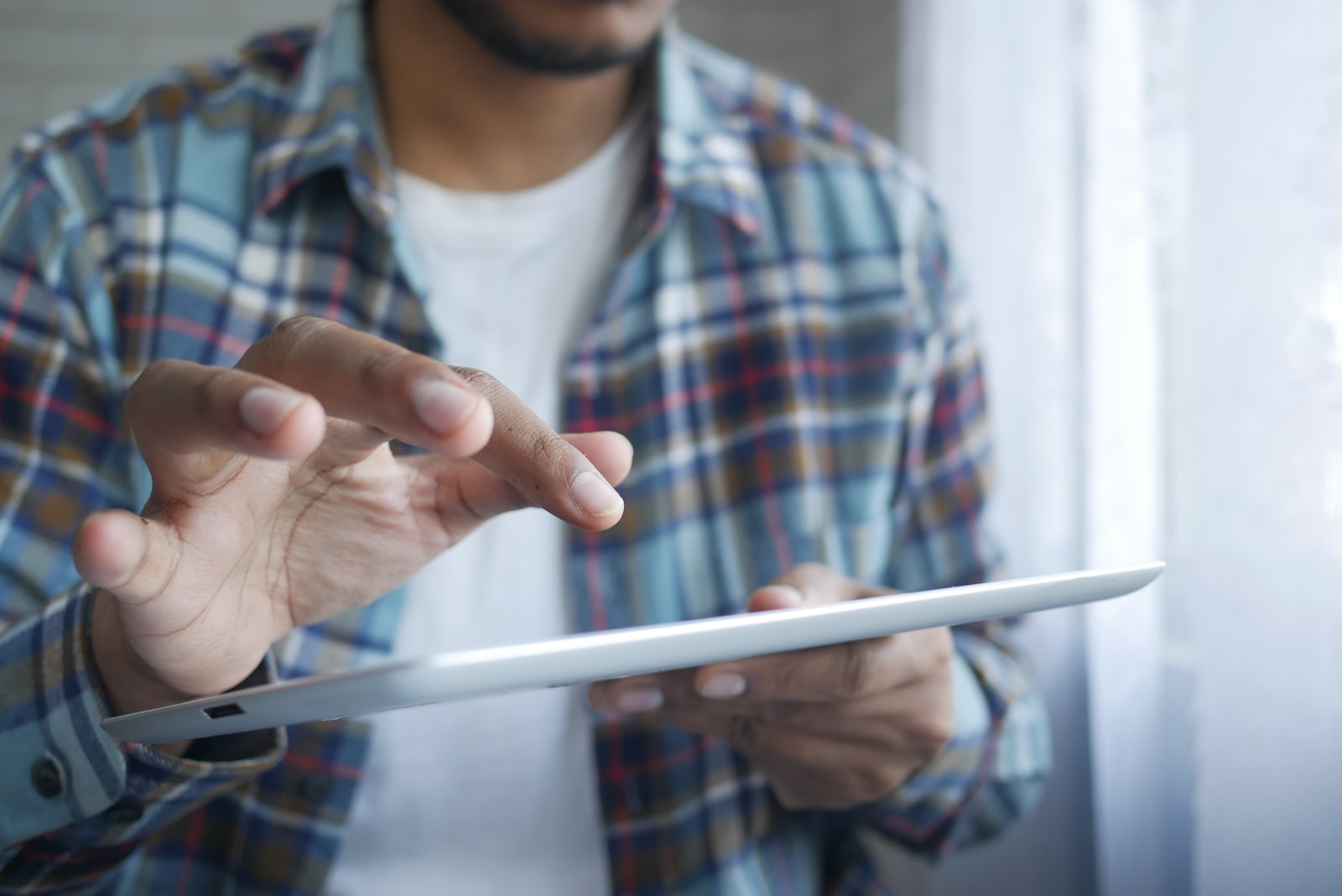 One Forma Review 2024 – Is it Legit or Scam 3 man in red and blue plaid button up shirt holding white tablet computer