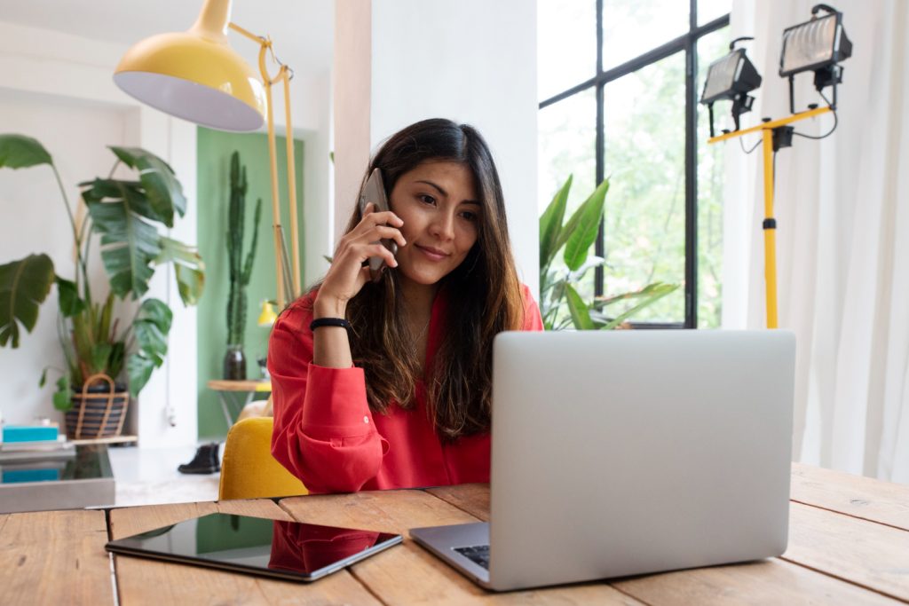 medium shot smiley woman with laptop