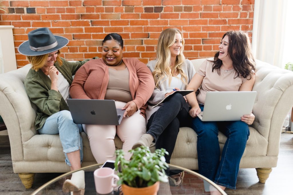 SurveySay Review a group of women sitting on top of a couch