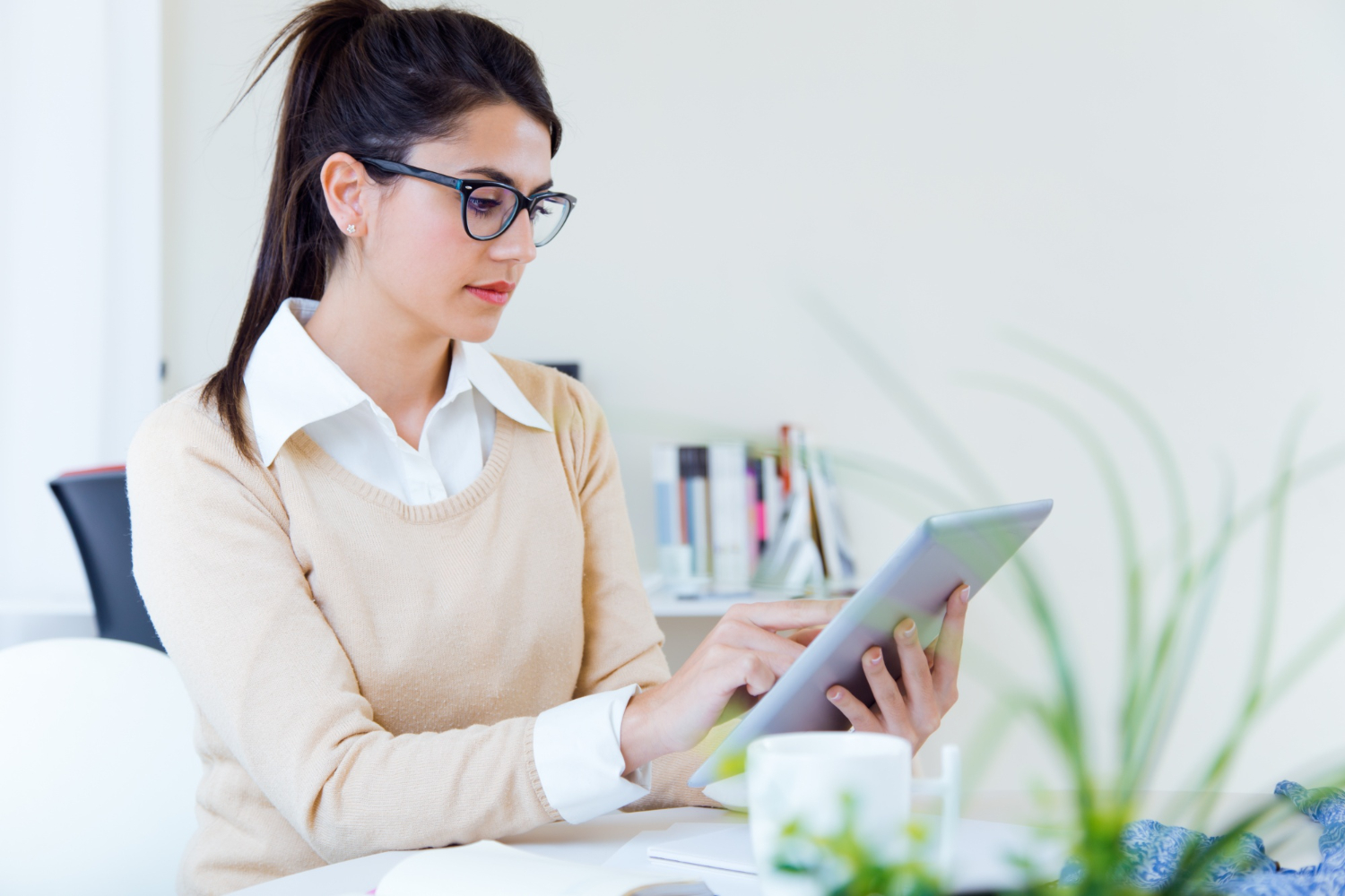 young businesswomen working with digital tablet her office