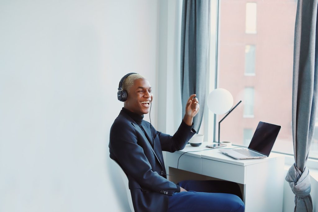 Sewing Jobs From Home man in black long sleeve shirt sitting on blue chair